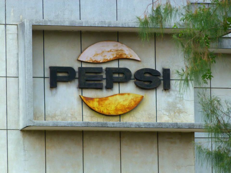 Cambodia Battambang abandoned pepsi factory logo