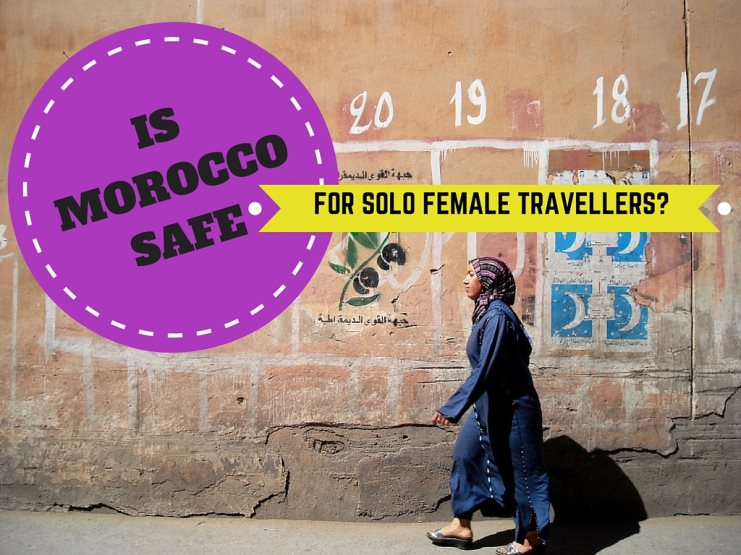 Graphic titled 'Is Morocco Safe For Solo Female Travellers?' over a woman walking past a weathered wall.
