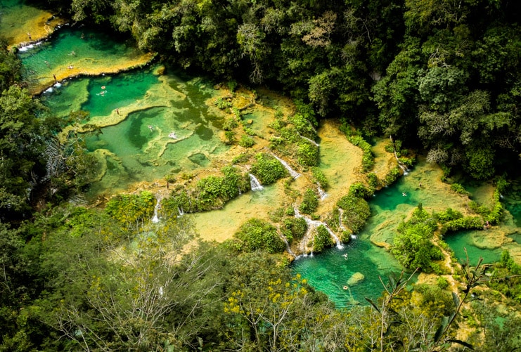The turquoise limestone pools of Semuc Champey surrounded by dense jungle in Guatemala.