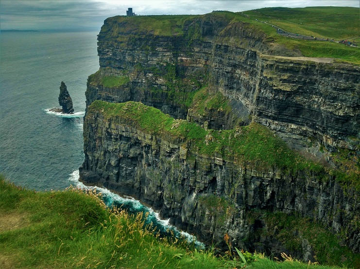 The layered Cliffs of Moher rising above the Atlantic, with O'Brien's Tower on the headland.