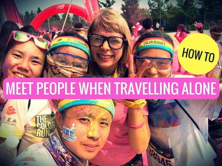 Graphic titled 'How To Meet People When Travelling Alone' over a Color Run selfie with Alice.