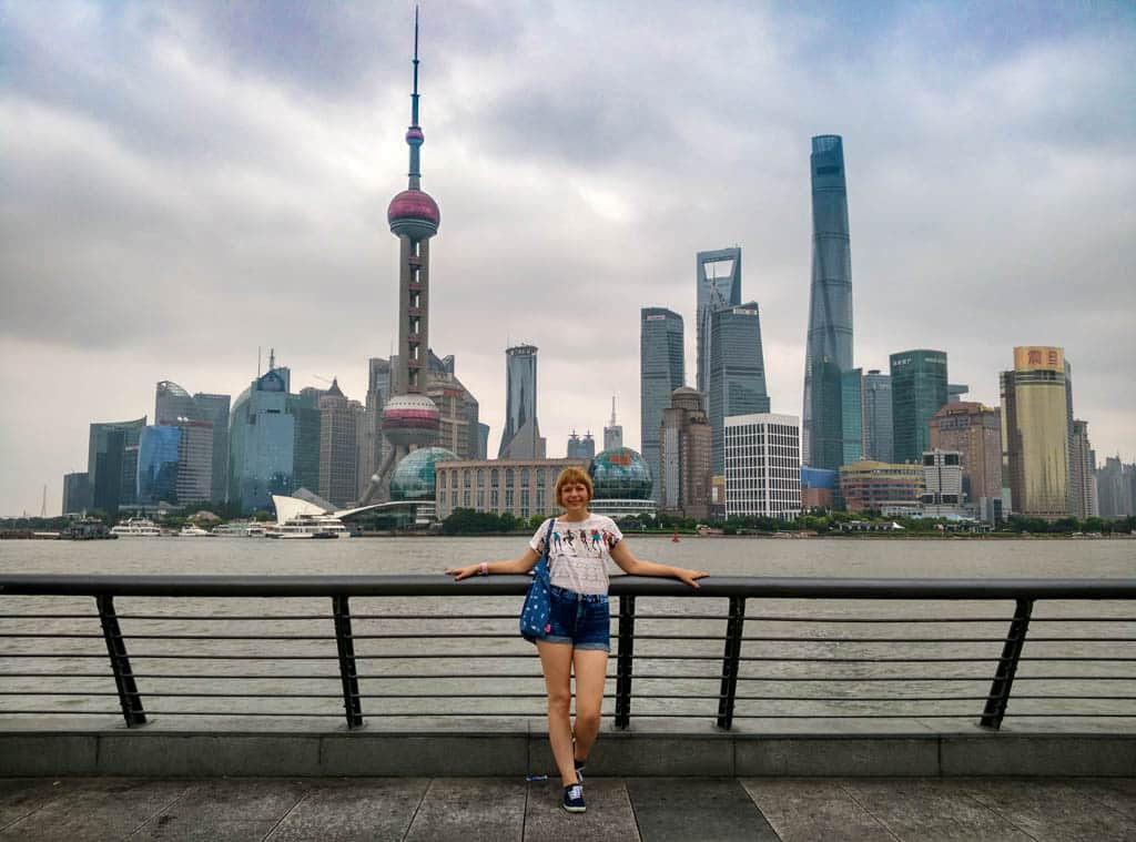 Blogger Alice standing in front of Shanghai City buildings skyscrapers