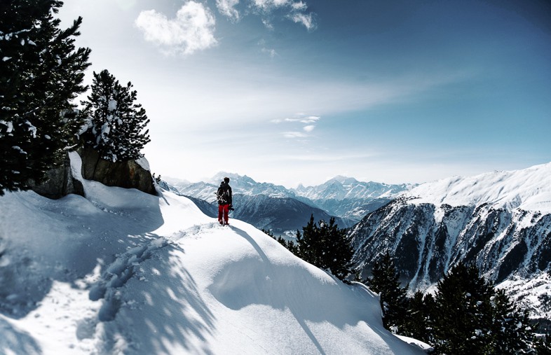 Going off the beaten path in the snow hiking high in the mountains is one of the reasons to travel