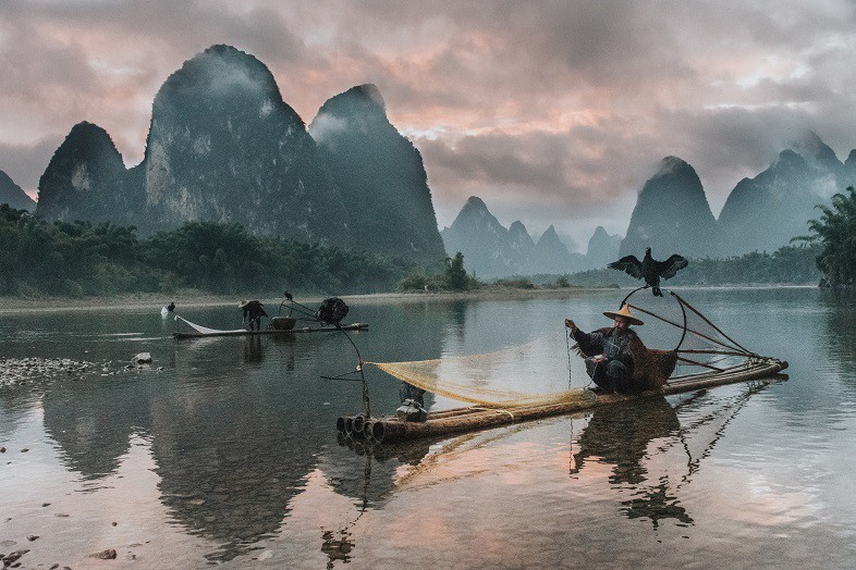 Fisherman along the Li River in China Xingping