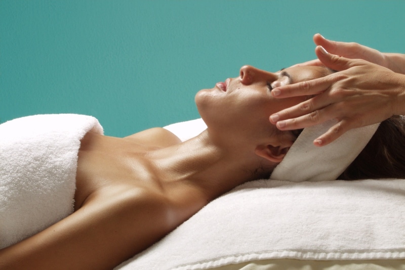 Single woman enjoying being pampered on her spa day