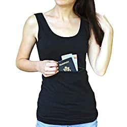 A woman in a black vest top slides a passport into a hidden front pocket.